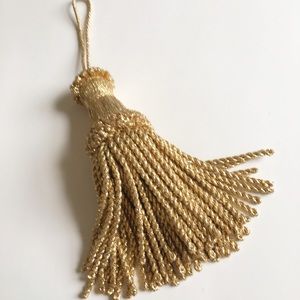 Large gold tassel, glitters, draperies ,lamps,more